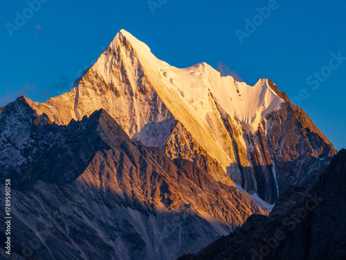 Aerial view of hikers trekking in autumn landscape of Daocheng Yading, Sichuan, China