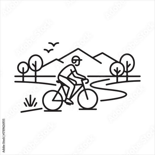 Man Riding Bicycle Through Scenic Mountain Landscape