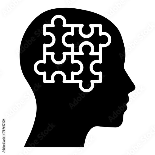 Silhouette of Human Head with Interlocking Puzzle Pieces Inside Symbolizing Thought Process and Problem Solving