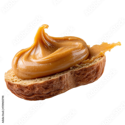 Smooth peanut butter spread on surface concept. Delicious creamy peanut butter spread on a slice of bread.