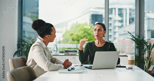 Laptop, meeting and business women in office with feedback on corporate performance review. Discussion, computer and female hr manager with employee for advice on career evaluation in workplace.