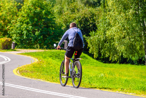 Cyclist ride on the bike path in the city Park
