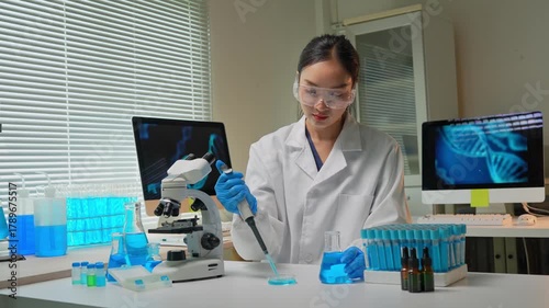 Asian female scientist working on dna research in laboratory