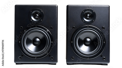 Pair of black studio monitor speakers on a dark background for audio production and sound engineering