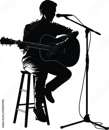 Silhouette of Singer-Songwriter Musician Seated on a Stool, Performing Live with Acoustic Guitar and Microphone for Concert Events