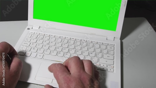 Computer typing and mouse scrolling on green screen background showcasing digital workflow and productivity tools