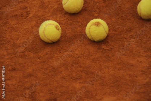 Tennis Balls on Clay Court Surface – Minimal Sport Texture and Focus Concept