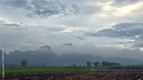 clouds over the field mountain