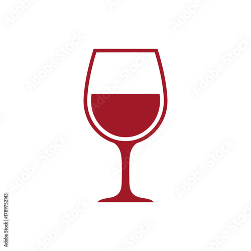 Glass of red wine sits on white table, ready to be enjoyed during a relaxing evening, creating a cozy and inviting atmosphere.