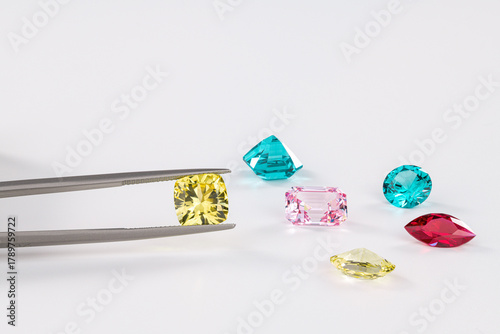 A close up of a gemstone collection with a magnifying glass