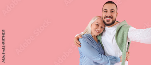 Young man hugging his mothe...