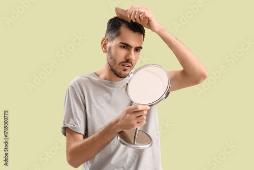 Young man with dandruff and...