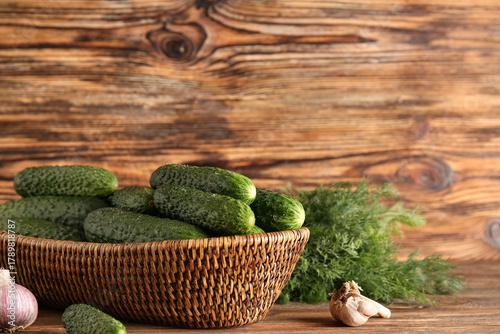 Fresh green cucumbers in wi...