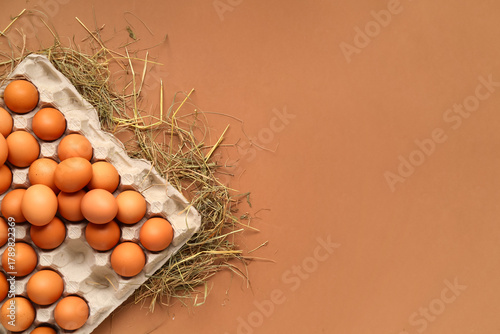 Eggs in carton box with hay...