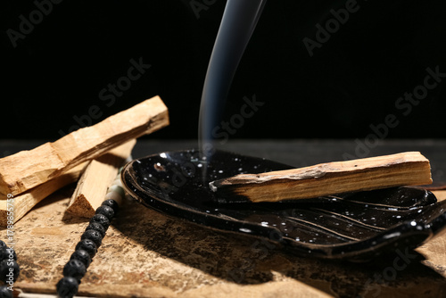 Old book, palo santo and be...