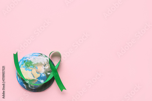 Green ribbon and paper plan...