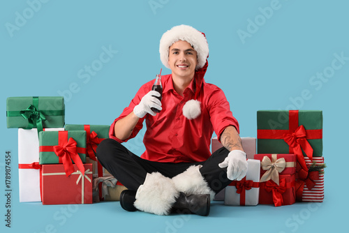 Young Santa Claus with cola...