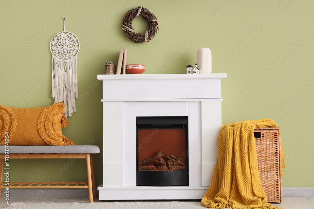 Fototapeta premium Interior of living room with soft bench, fireplace and basket