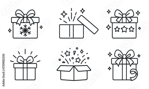 Set of holiday gift boxes with stars and bows on dark background