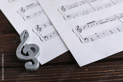 Note sign with music sheets...