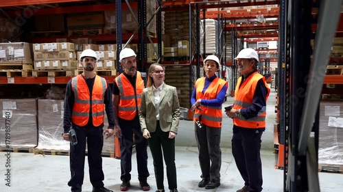 Female warehouse manager training new employees