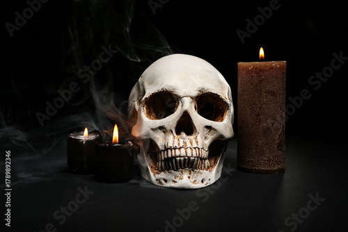 Human skull with burning ca...