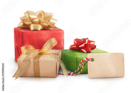Three festive Christmas boxes in green and red with golden bows stand out on a transparent background.