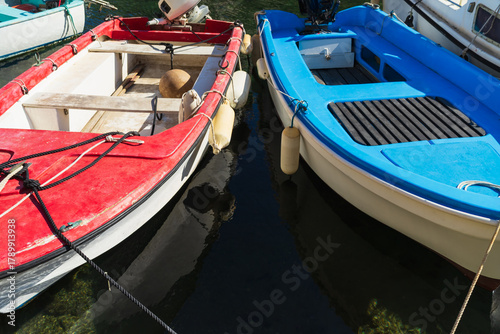 Wallpaper Mural Two colorful small boats, red and blue, moored in a picturesque port in the Calanques National Park, France. Torontodigital.ca