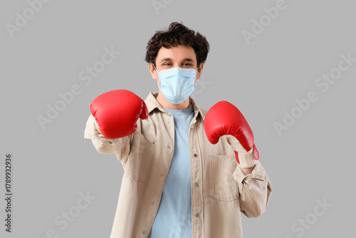 Young man in medical mask w...