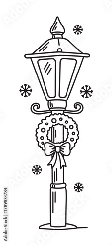 Christmas street lamp decorated with a festive wreath and bow. Winter holiday line art with snowflakes for seasonal celebration. Vintage lamppost icon for greeting cards