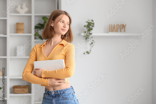 Young woman with modern lap...