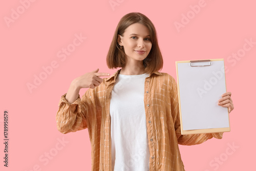 Young woman pointing at bla...