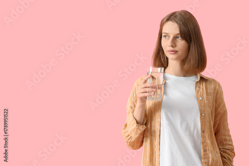 Young woman with glass of w...
