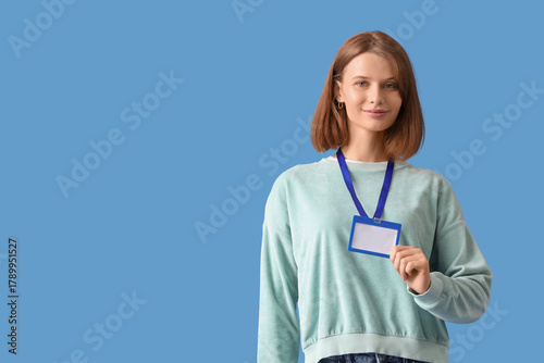 Young woman with blank badg...