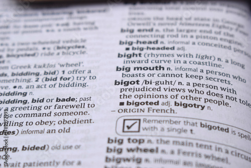 English Definition Dictionary Page Close Up Of Printed Word Of -bigot