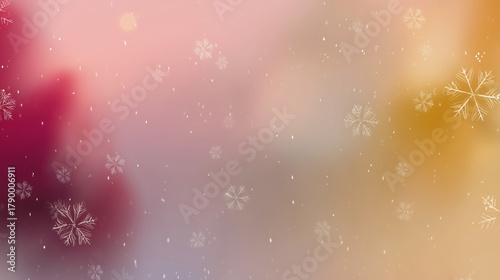 A blurry image of snowflakes with a pink and orange background