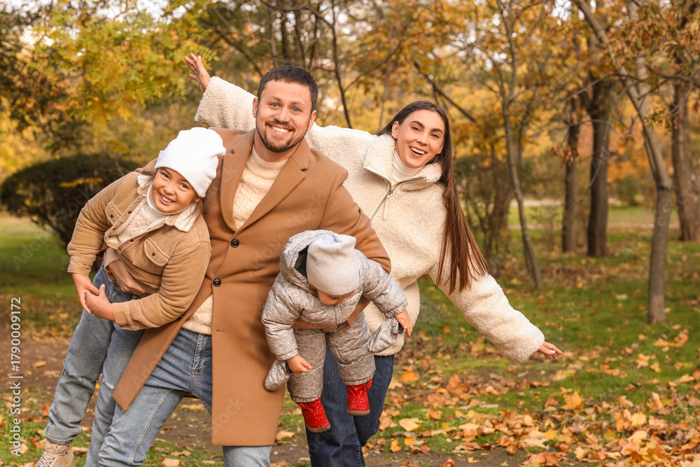Fototapeta premium Happy family in park on autumn day
