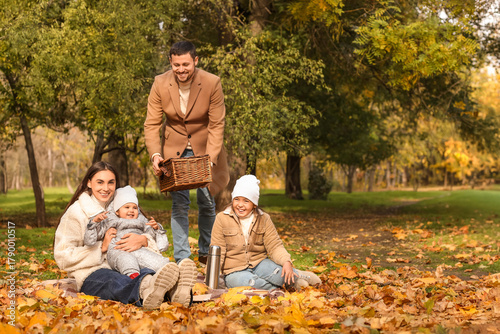 Happy family having picnic ...