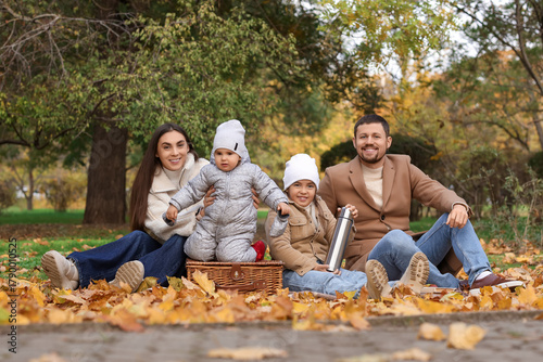 Happy family having picnic ...