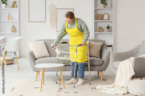 Mature woman with walker cl...