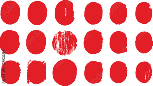 A collection of rough red circular shapes with textured and distressed edges on a white background