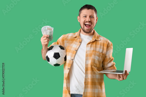 Happy young man with soccer...