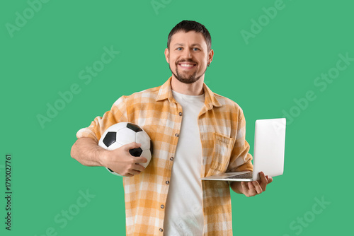 Happy young man with soccer...