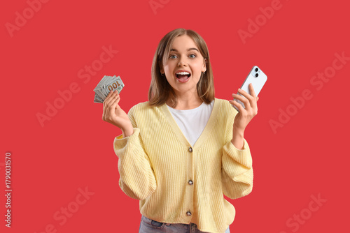 Happy young woman on red ba...
