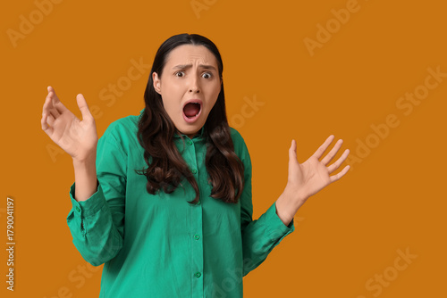Scared young woman screamin...