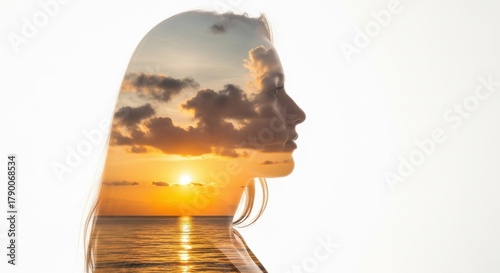 Woman's silhouette blends with serene sunset over tranquil ocean, capturing beauty and peace during golden hour