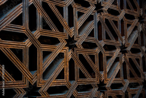 Beautiful Islamic art of wooden lattice on window in the Mosque-Cathedral of Cordoba, UNESCO World Heritage Site in Spain. Moorish art - Antique Arab interior design. Old Arabic architecture feature.