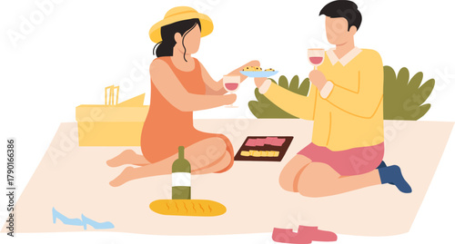 Couple enjoying picnic outdoors drinking wine and eating