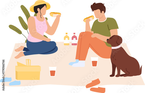 Couple eating hot dogs on picnic with dog outdoors