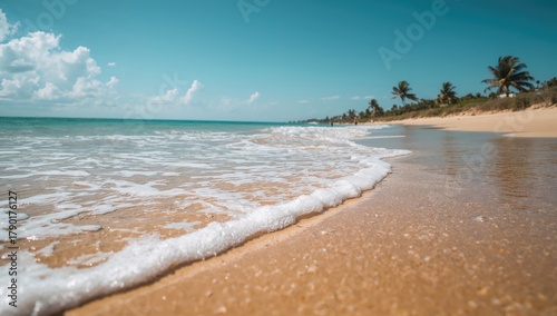 Fototapeta Naklejka Na Ścianę i Meble -  Sea water mingles with sandy beach, erosion risk